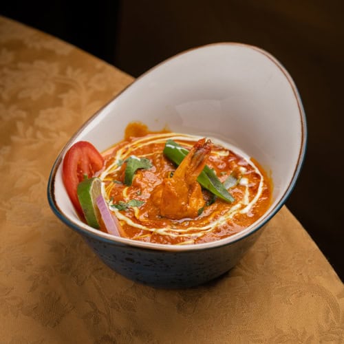 Tiger prawn curry cooked with Indian spices, served for lunch in Lisbon or dinner in Lisbon.