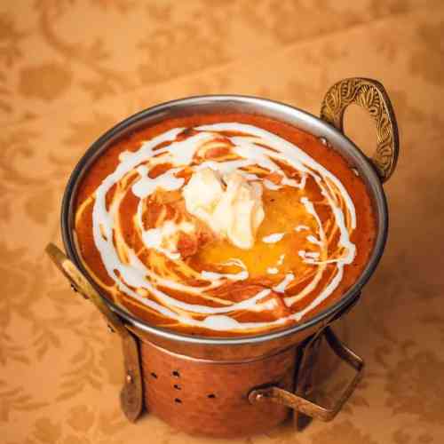 Butter chicken, a creamy Indian curry, perfect for lunch in Lisbon.
